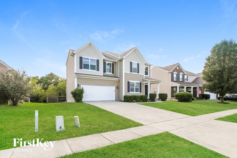 A large house with a garage is for sale by FirstKey Homes.