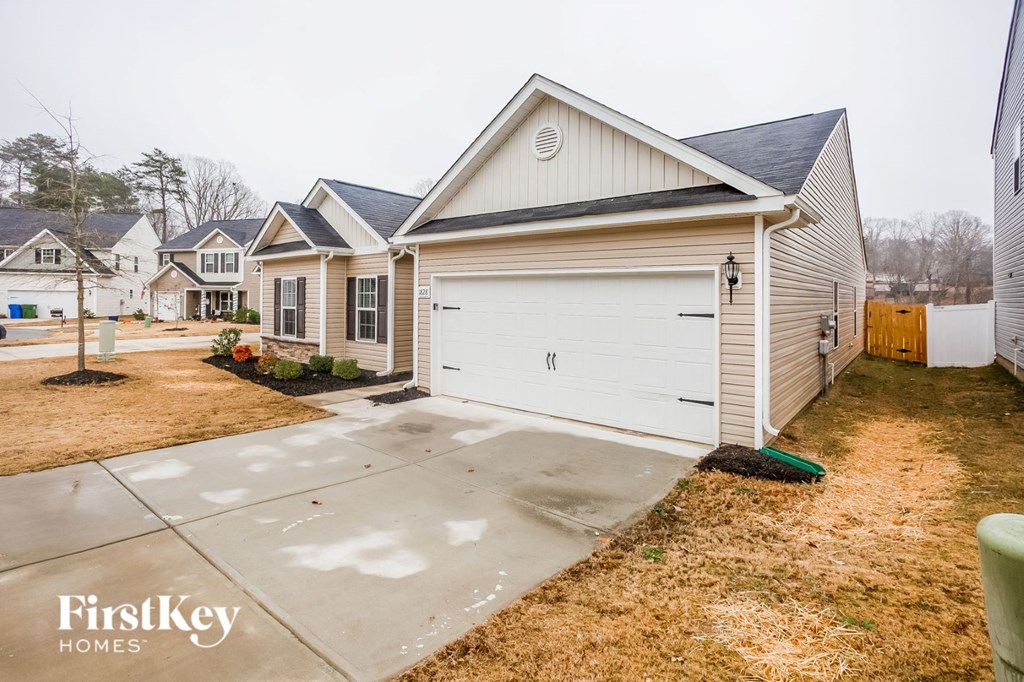 a white garage door in front of a house