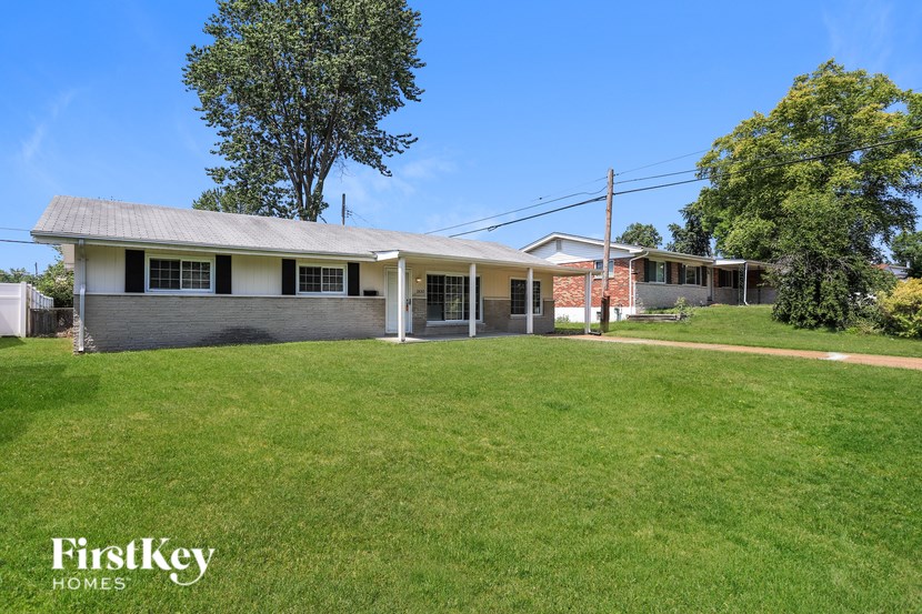 A house with a lawn in front of it.
