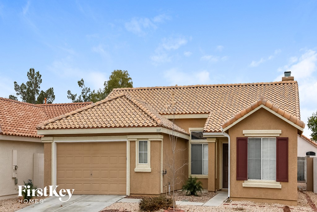 A house with a brown roof and a garage door.