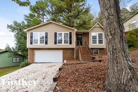 a house with a large tree in front of it