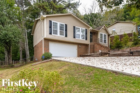 a house with a driveway and a garage door