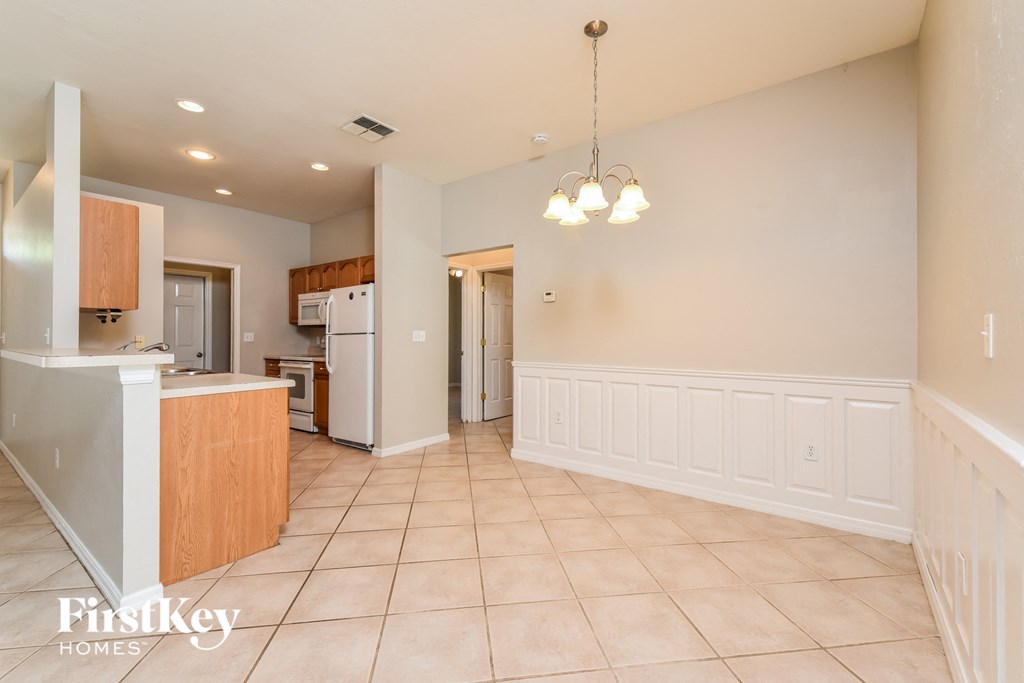 the kitchen and dining area are open to the living room