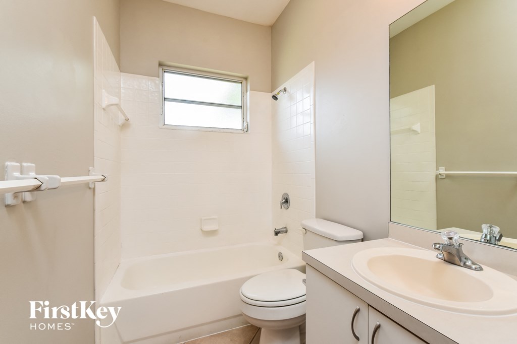 a bathroom with a sink toilet and a shower