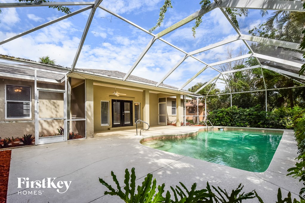 the pool is under the glass roof of the house