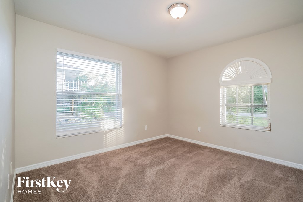 A room with a FirstKey Homes logo on the floor.