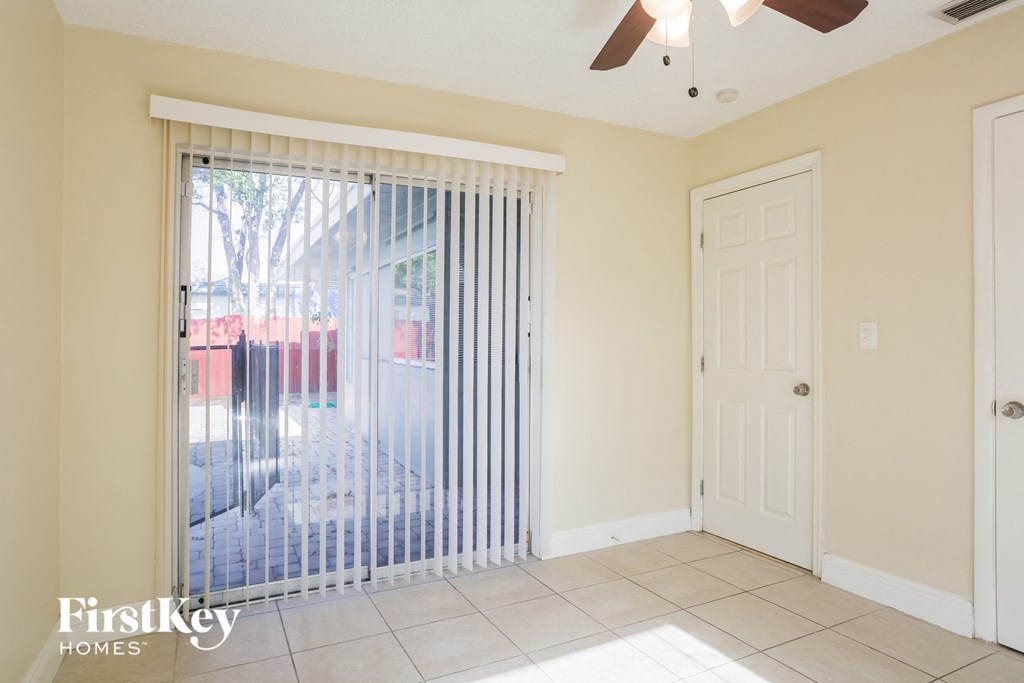 the living room has a sliding glass door to the patio