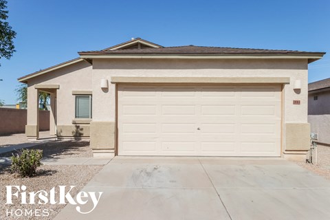 a home with a white garage door in front of it