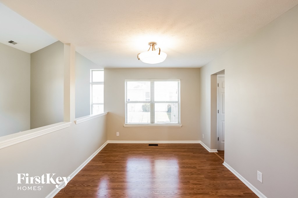 A room with wooden floors and a window.