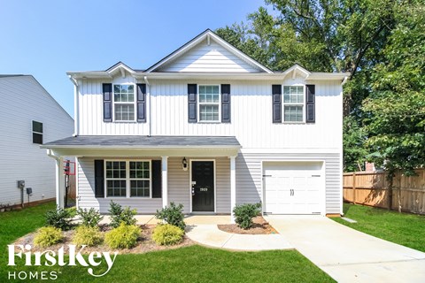 A white house with a black door and windows is shown with the words "FirstKey Homes" on the bottom left.