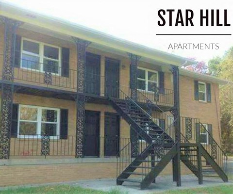 an apartment building with a staircase   and apartments