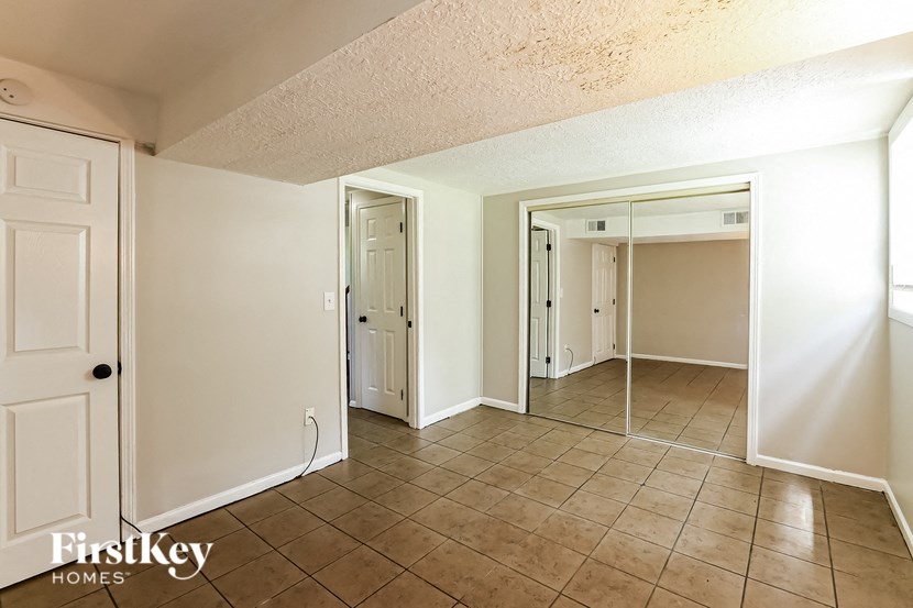 the living room and dining room of an empty house