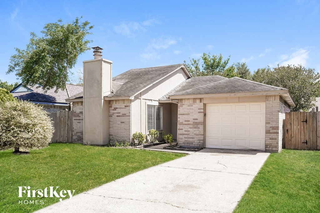 A house with a garage is for sale by FirstKey Homes.
