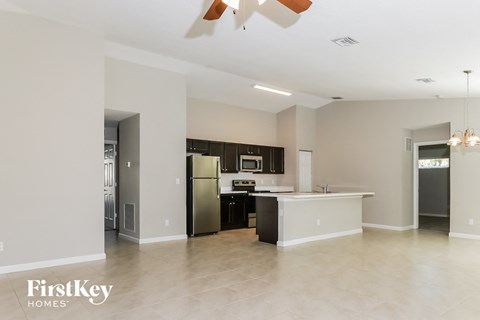 a kitchen with a stainless steel refrigerator and a counter top