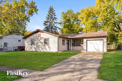 A house with a driveway in front of it.