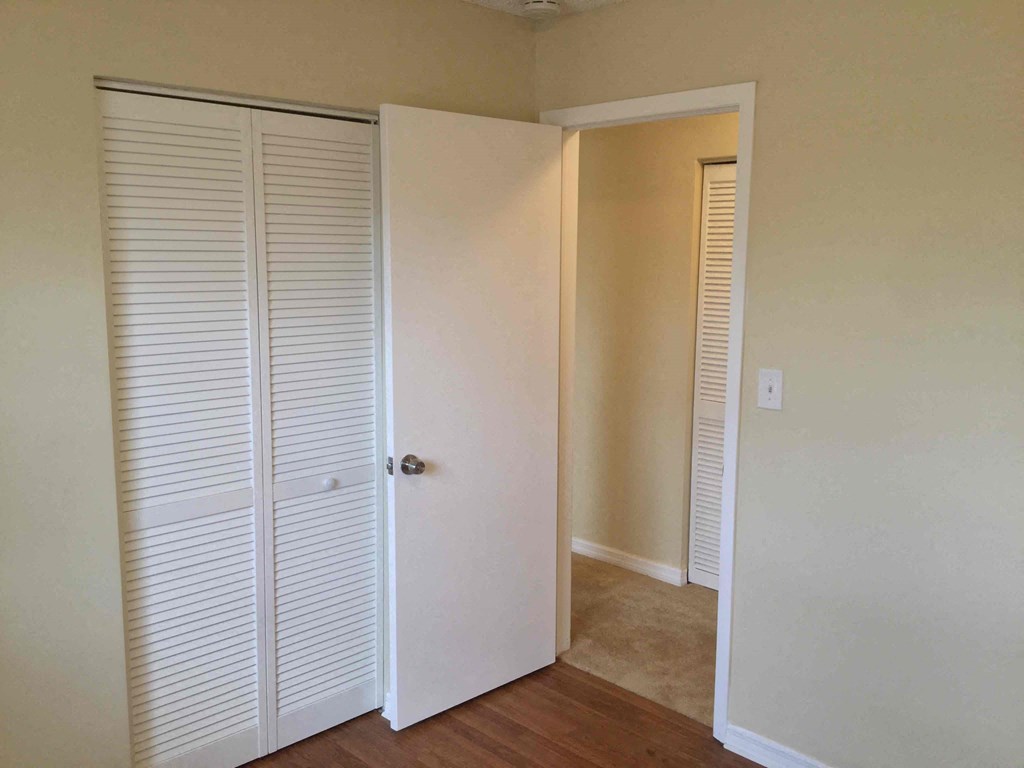 the closet in the master bedroom has shutters on the doors