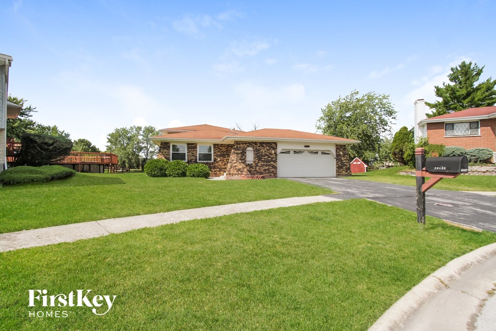 A house with a garage is for sale by FirstKey Homes.