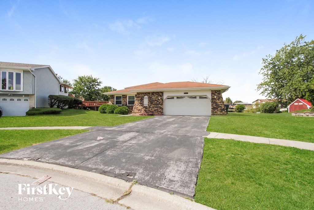 A house with a garage is for sale by FirstKey Homes.