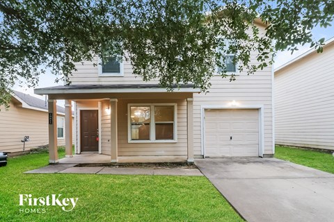 A house with a garage is for sale by FirstKey Homes.