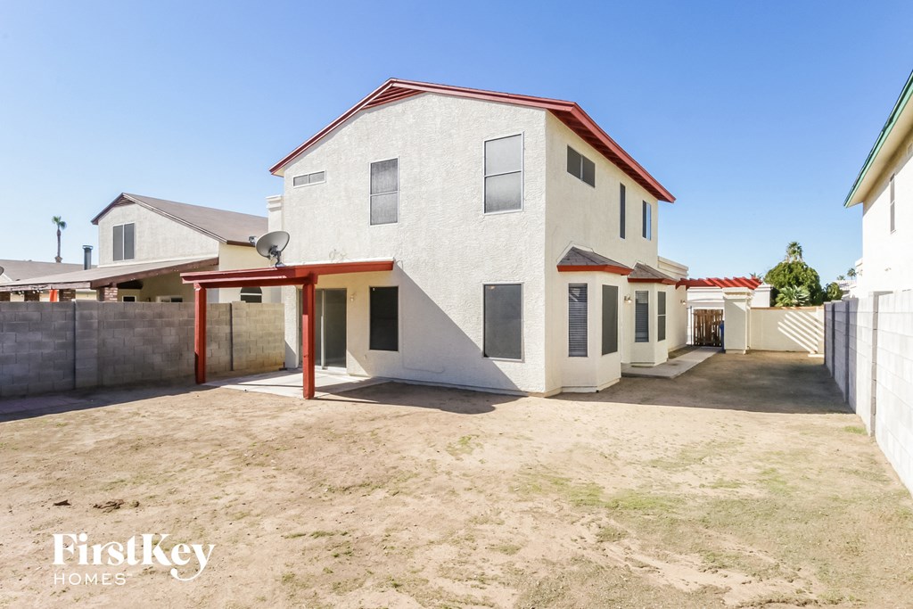 a white house with a driveway and a garage door