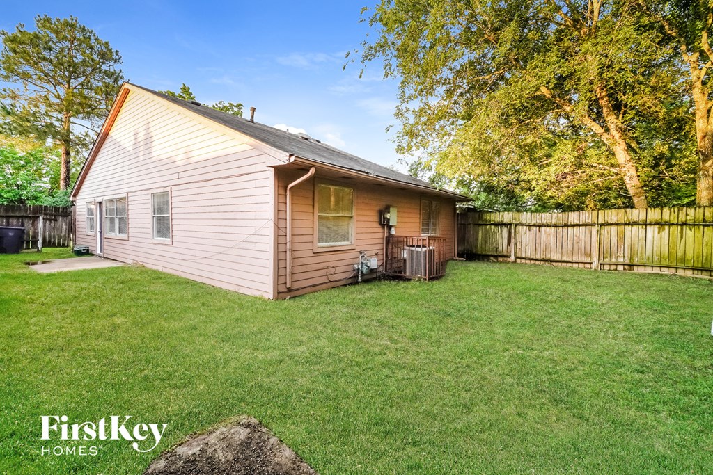 a small house with a yard and a fisheye lens