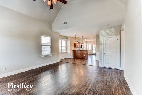 the living room and dining room are open to the kitchen and living room
