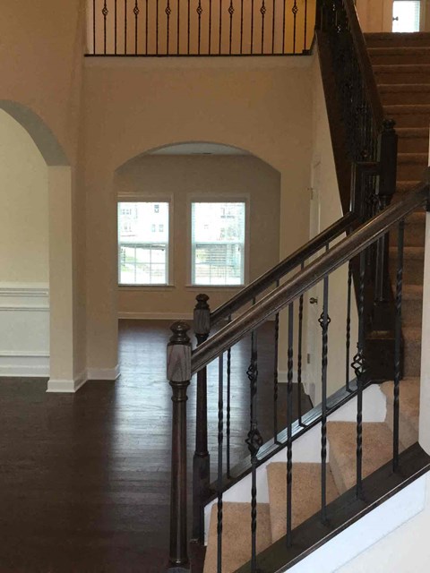 a view of a staircase in a house from the bottom of the stairs