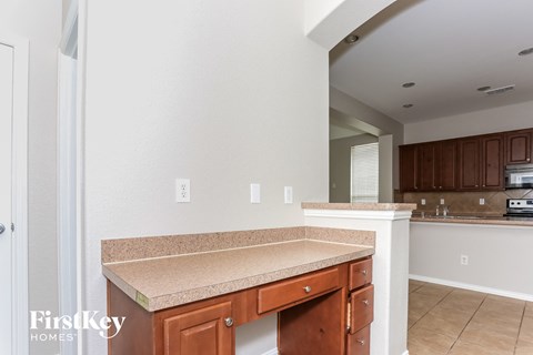 A kitchen with a counter top and cabinets.