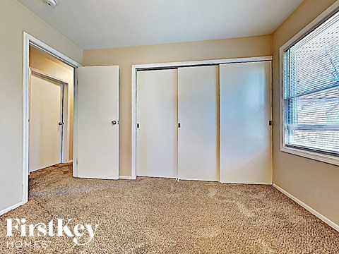 the third bedroom has three closets and a window