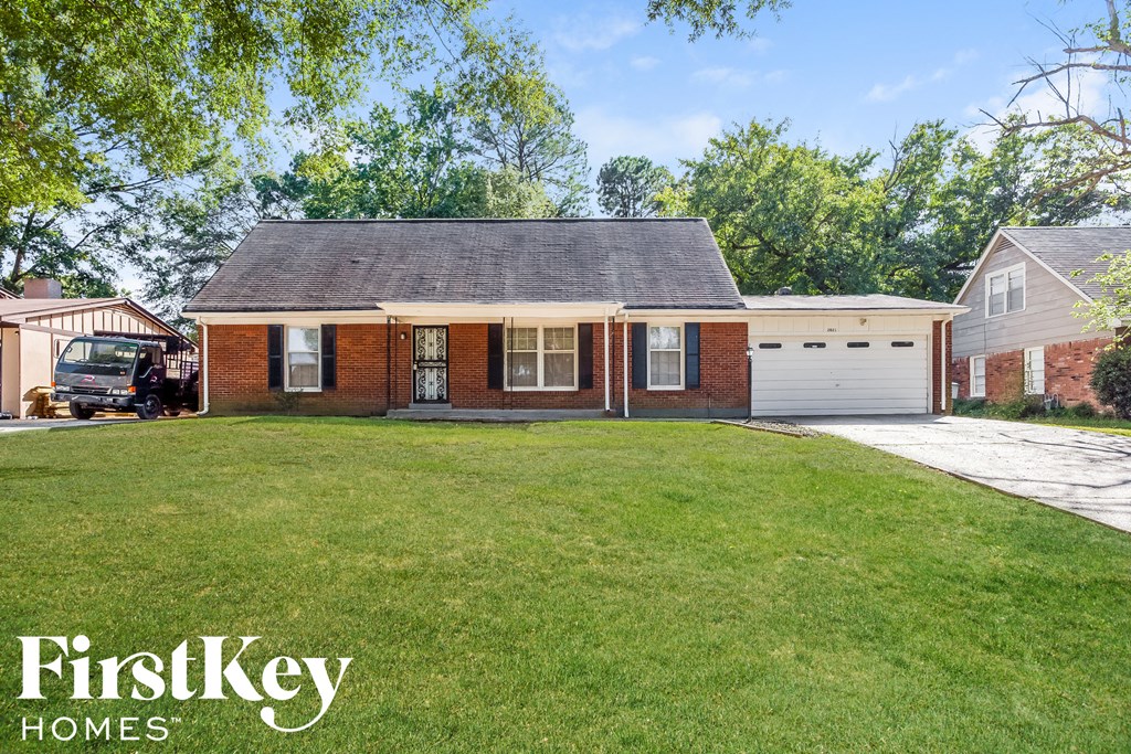 A brick house with a garage is for sale by FirstKey Homes.