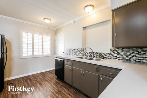 a kitchen with a sink and a window