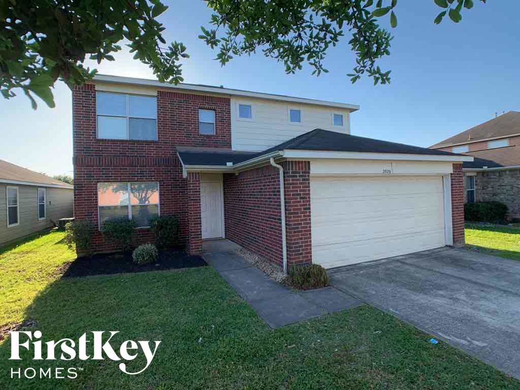 A house with a garage is for sale by FirstKey Homes.