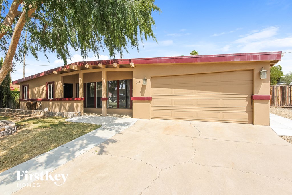 a house with a driveway and a garage door