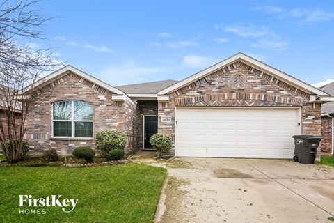 a brick house with a white garage door