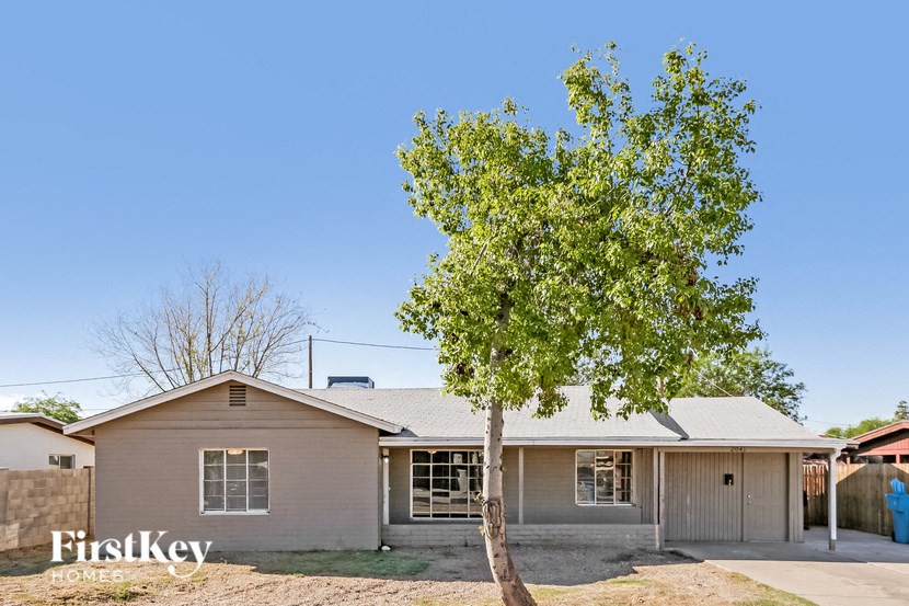 a house with a tree in front of it