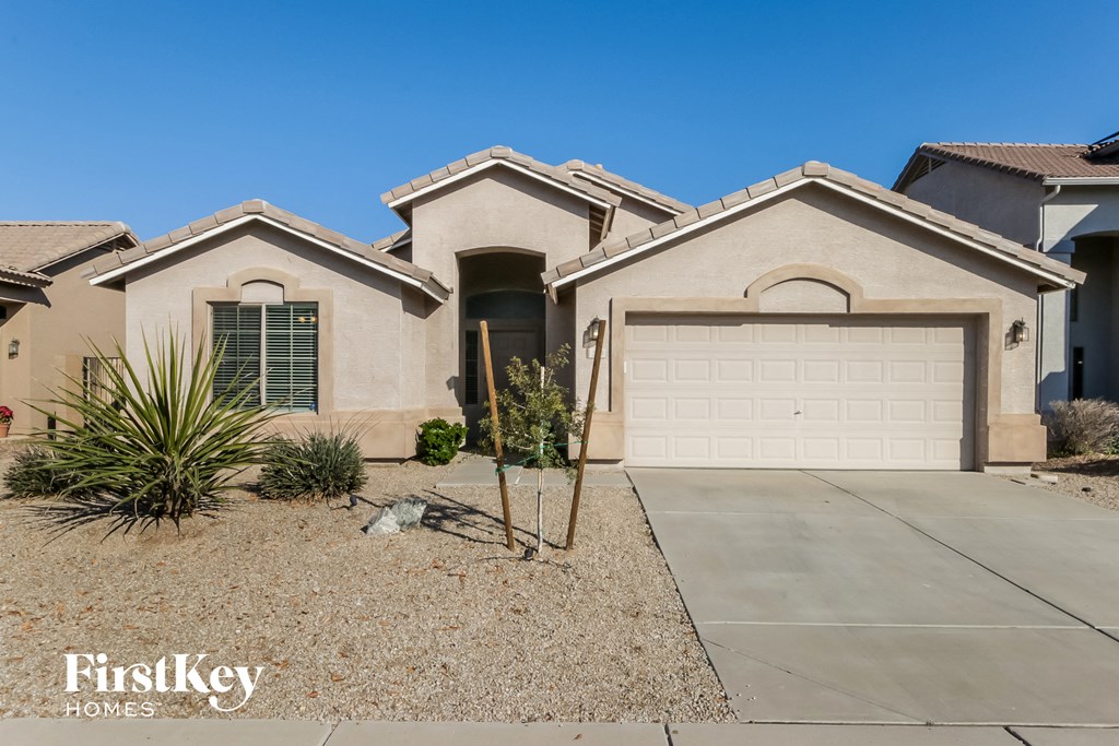 a house with a white garage door in front of it