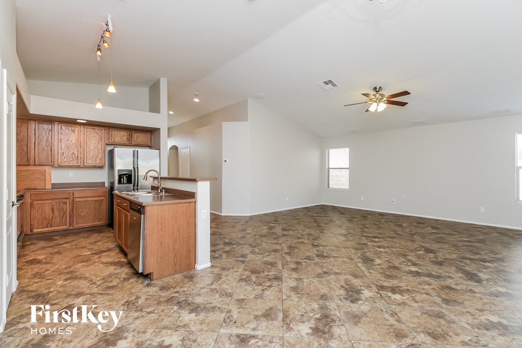 the kitchen is open to the living room and dining room