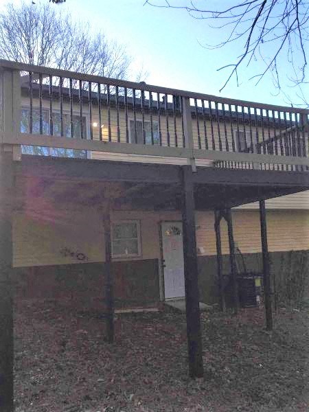 a house with a deck on top of it