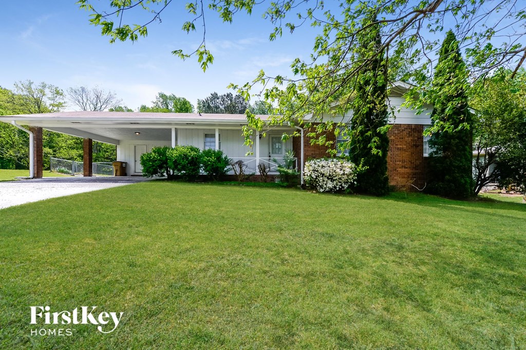 a house with a lawn in front of it