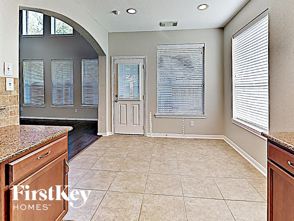 A kitchen with a tile floor and a counter top.