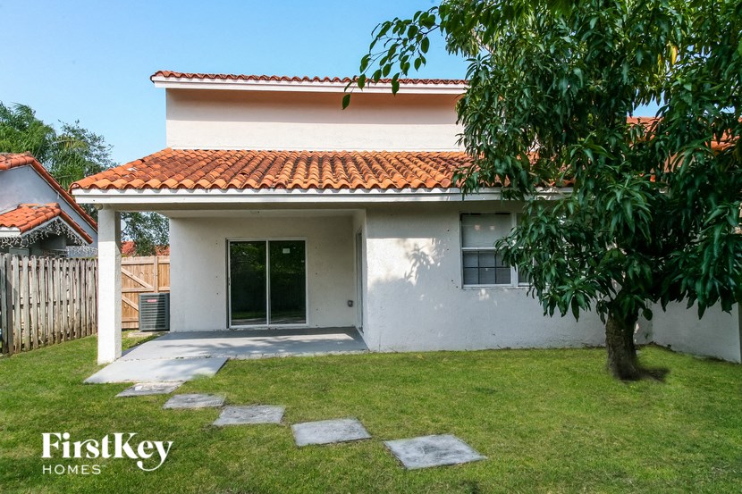 a house with a yard and a tree