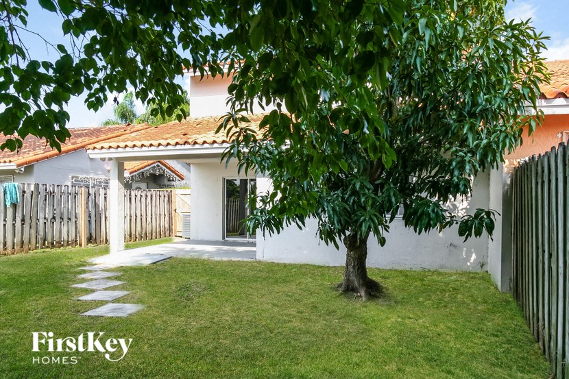 a house with a tree in the yard