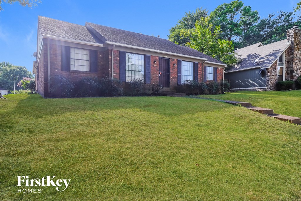 a house with a lawn in front of it