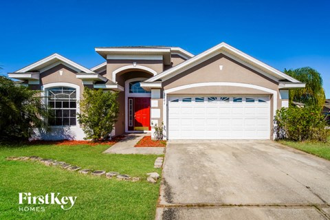 a house with a white garage door in front of it