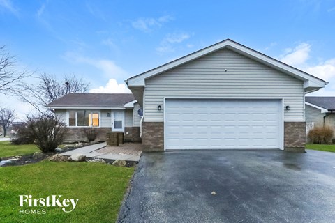 A house with a garage is for sale by FirstKey Homes.