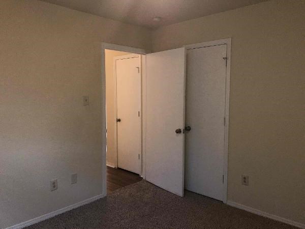 an empty room with two doors