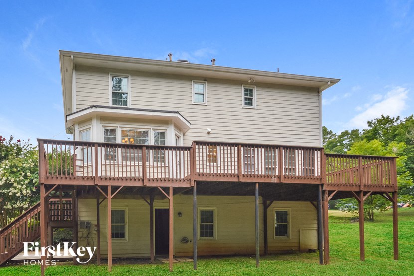 the back of a house with a deck