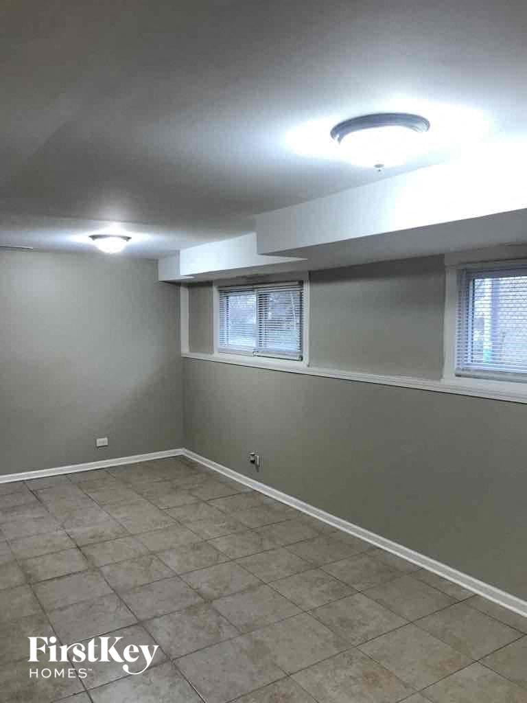 A room with a FirstKey Homes logo on the bottom left.