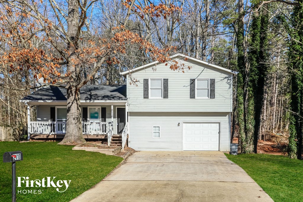 A house with a garage is for sale by FirstKey Homes.