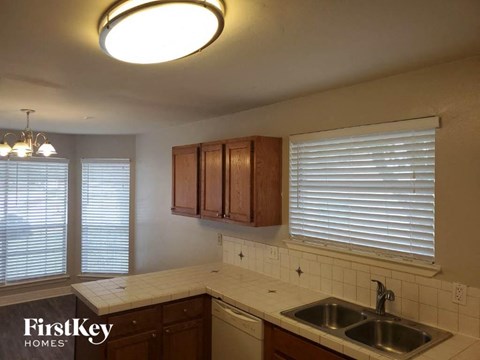 a kitchen with a sink and a window